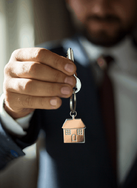 Real Estate Agent Holding Out Key Real Estate Agent Holding Out Key